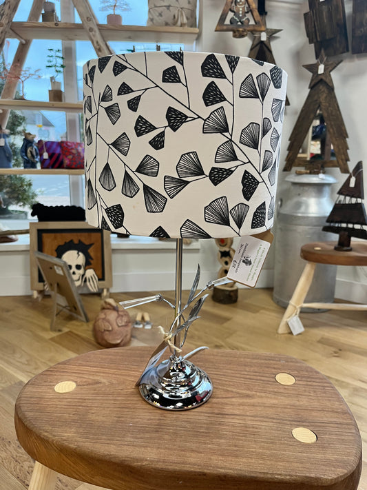 Black and white lamp shade with chrome base