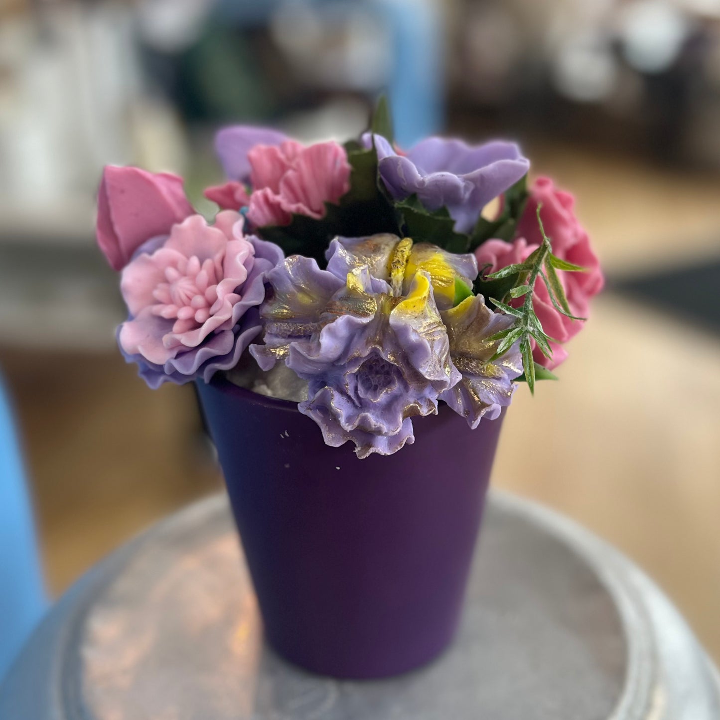 Soap flowers in purple vase