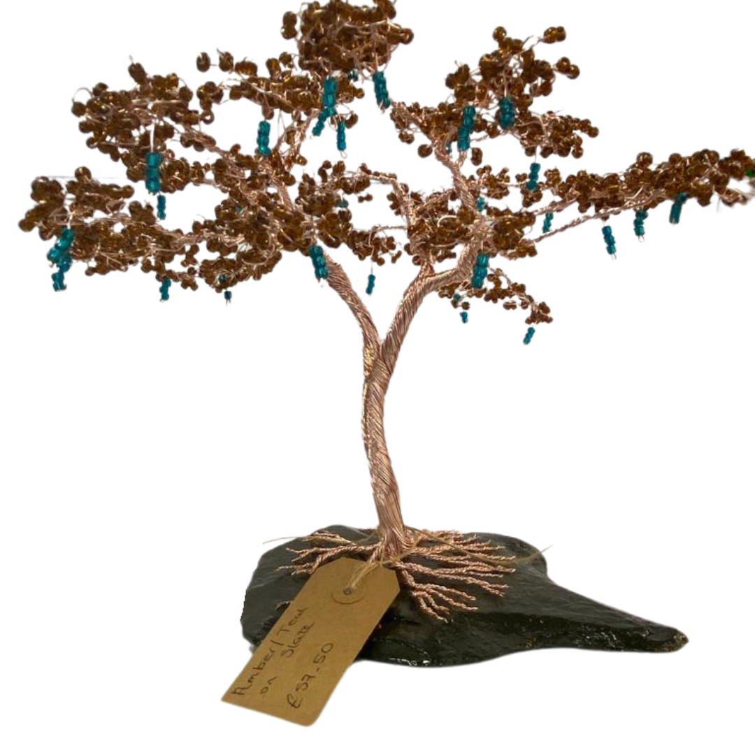 Wire tree in amber with teal stones