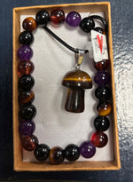 Beaded bracelet with a mushroom pendant in a box